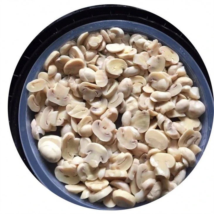 Sliced white mushroom in brine in drums